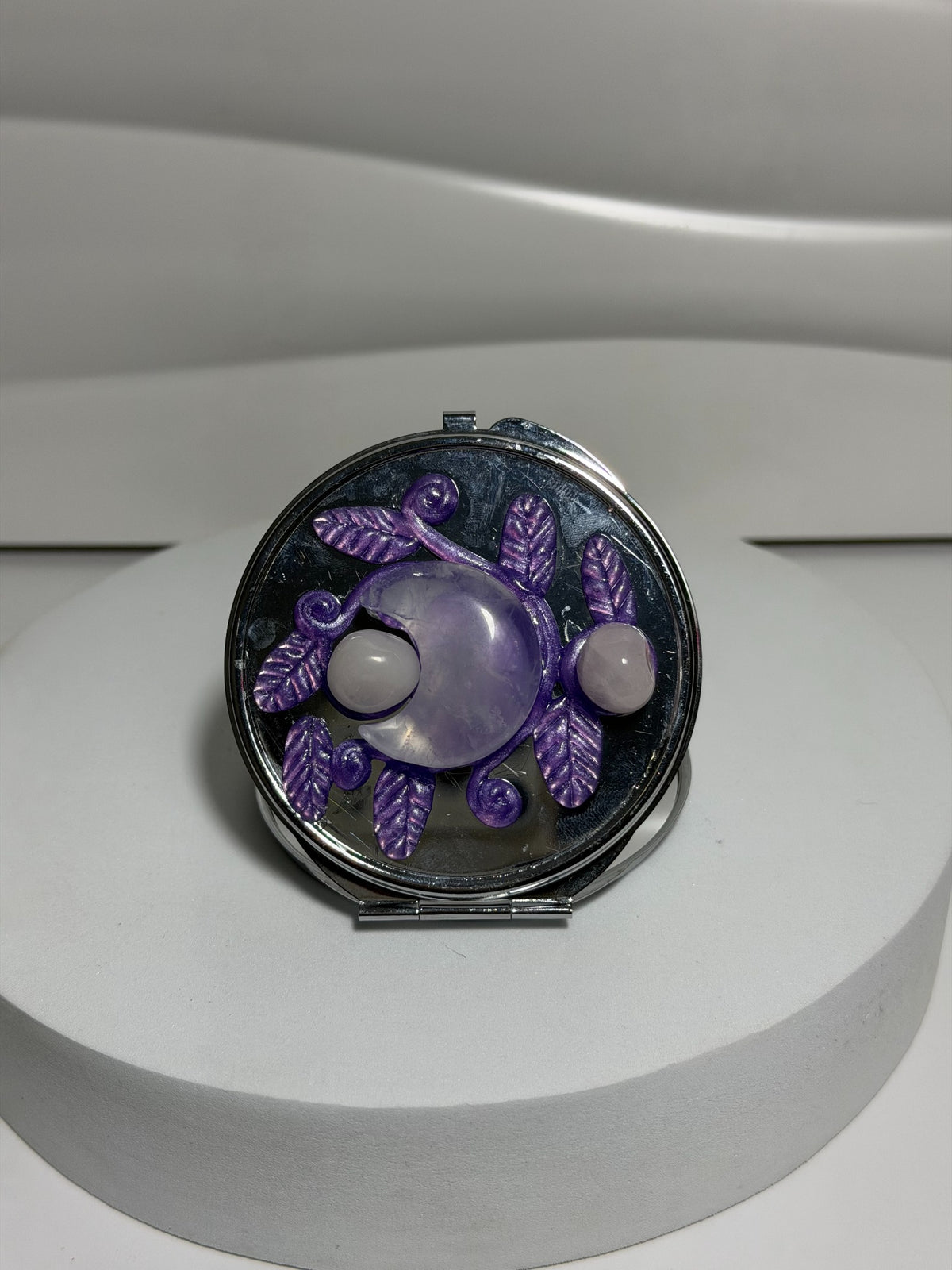 Amethyst crystal pocket mirror with moon and botanical design