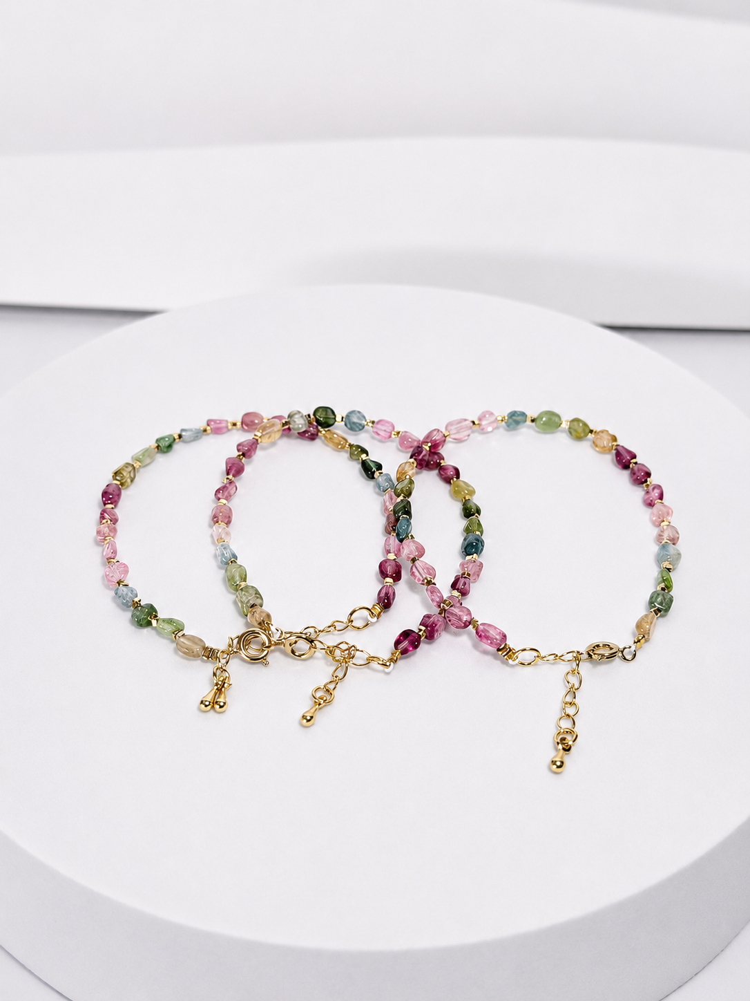 Colorful tourmaline nugget bracelet with brass clasp and gold-tone extender chain