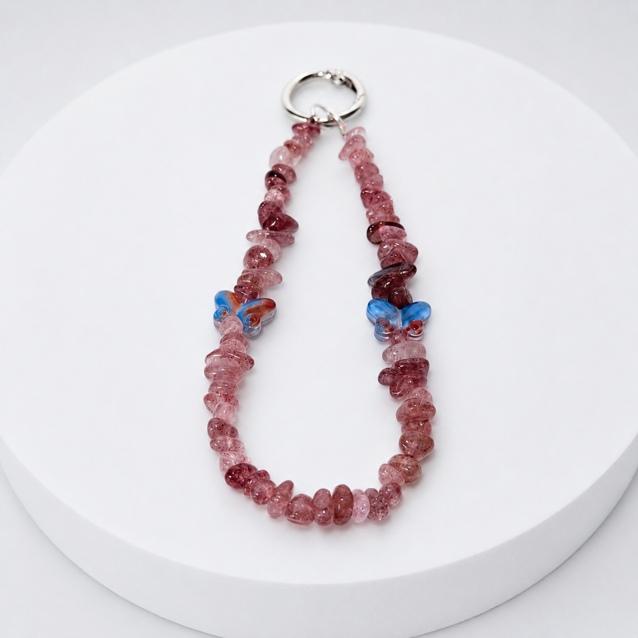 Cherry quartz chip phone and bag charm with opalite butterfly accents and silver-tone hardware
