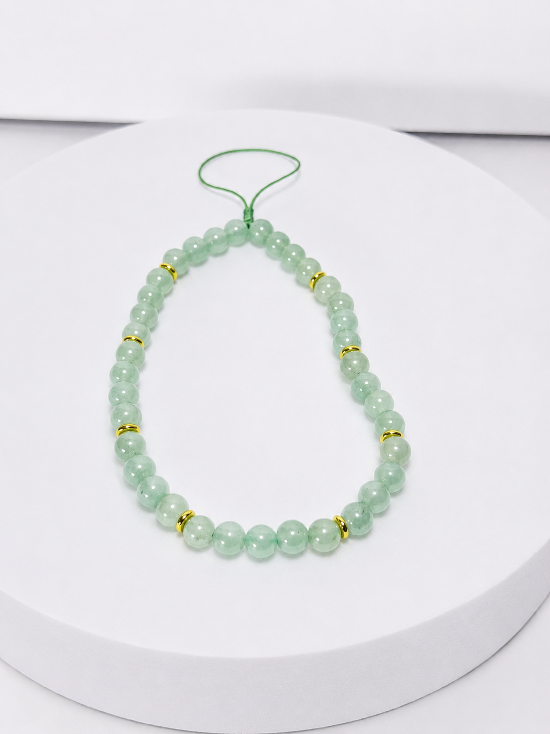 Green aventurine beaded phone and bag charm with gold-tone accents and green cord loop