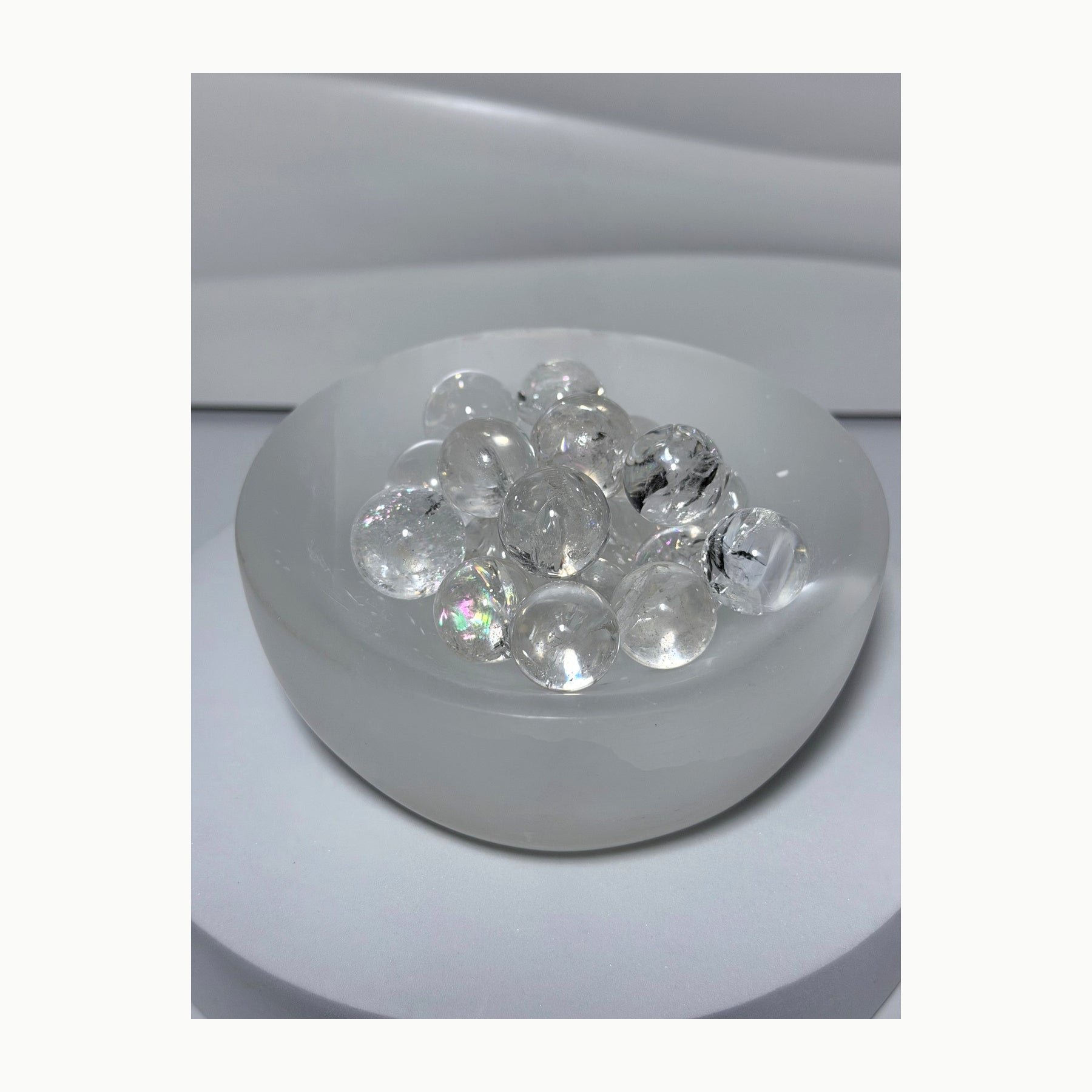 Mini clear quartz spheres with natural rainbow inclusions