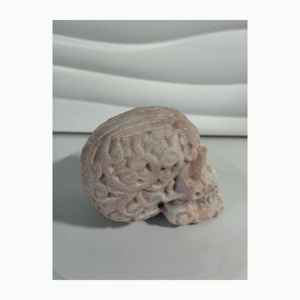 Pink Opal skull carving side view
