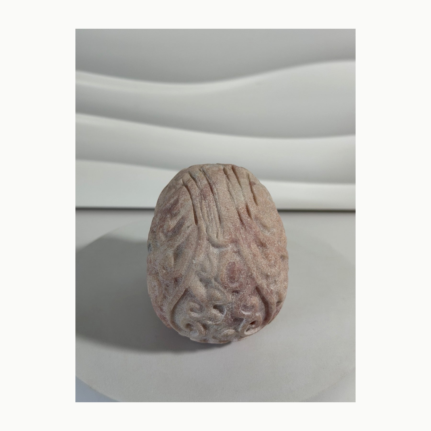 Pink Opal skull carving reverse view