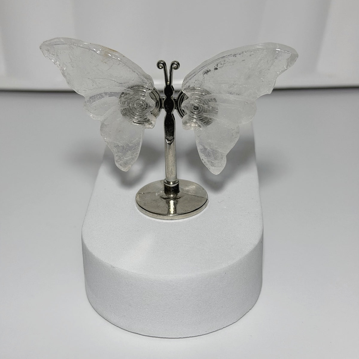 Clear Quartz butterfly crystal carving on silver stand