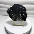 Covellite slab displayed on gold-tone stand