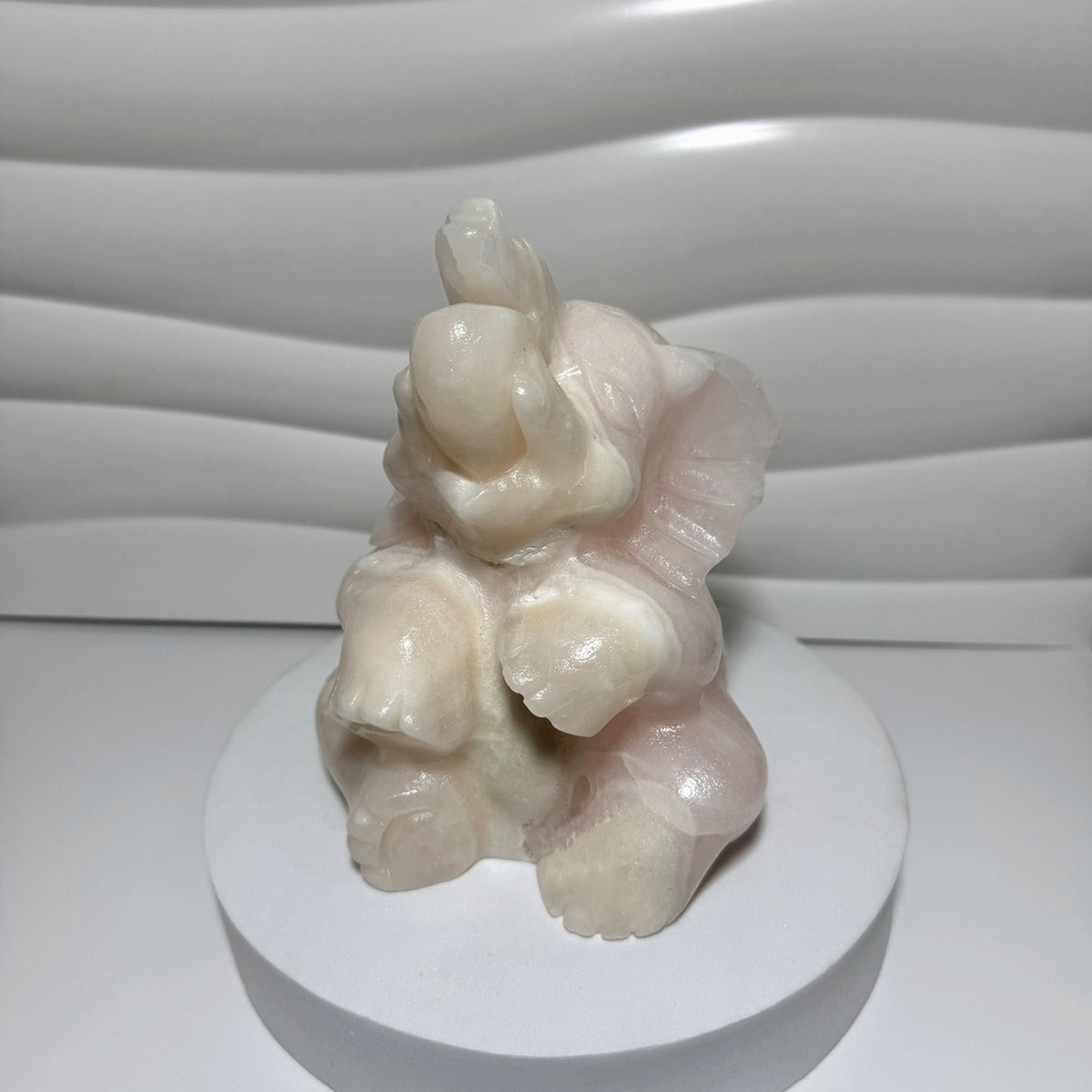 Large pink calcite elephant carving rear view