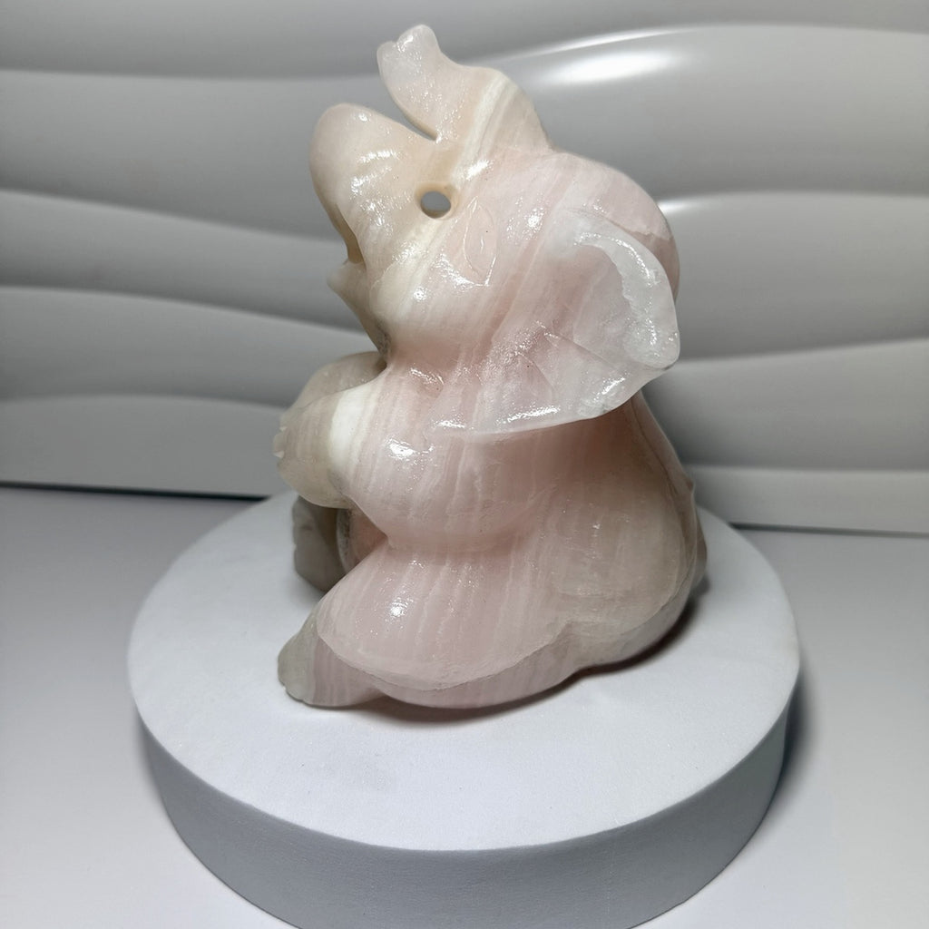 Large pink calcite elephant carving side view