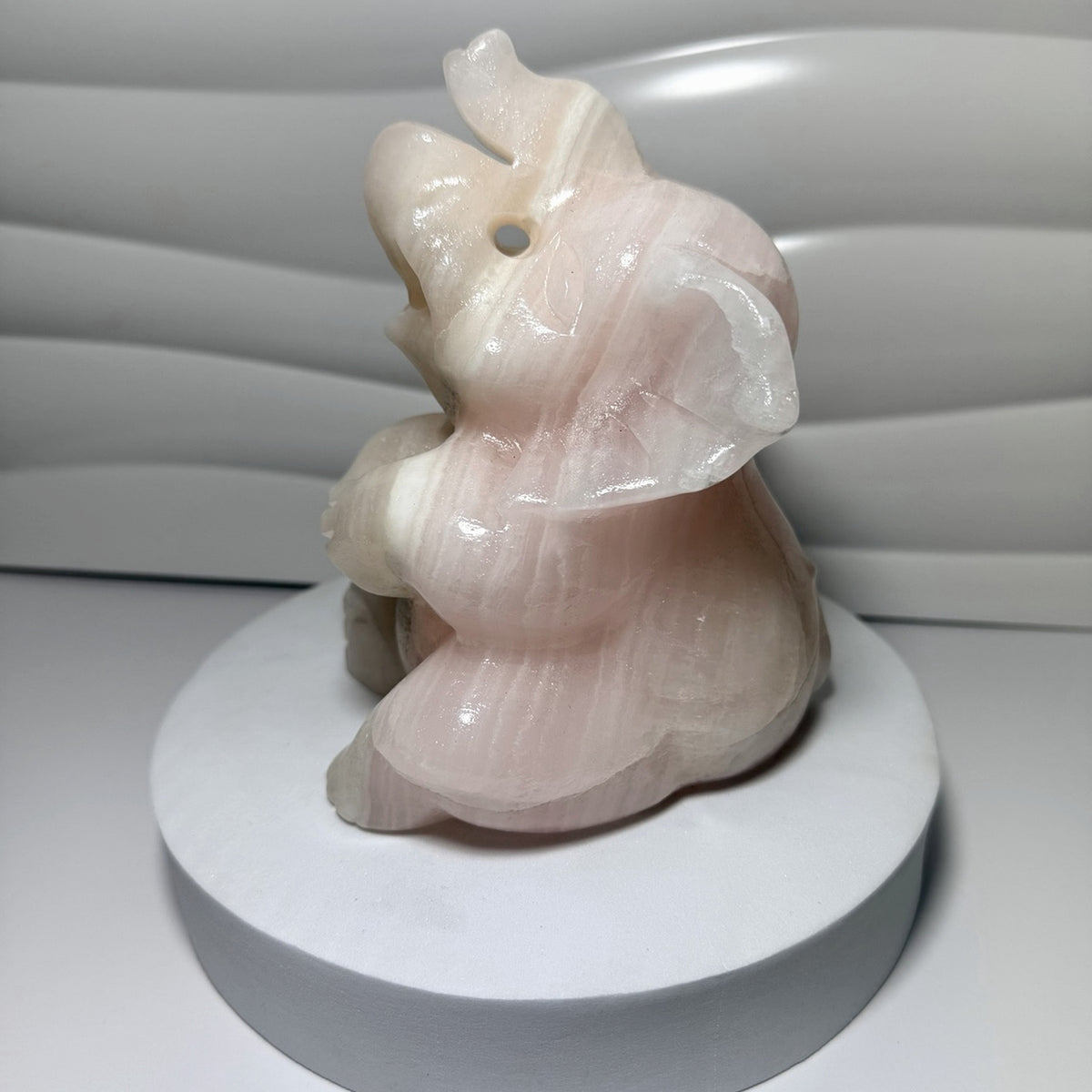 Large pink calcite elephant carving side view