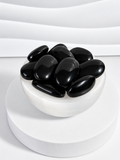 Black Obsidian 2-inch polished palm stones in white bowl