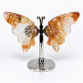 Golden Healer Quartz Butterfly on silver display stand