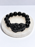 Black jade 12 mm stretch bracelet with hand-carved Pixiu center focal