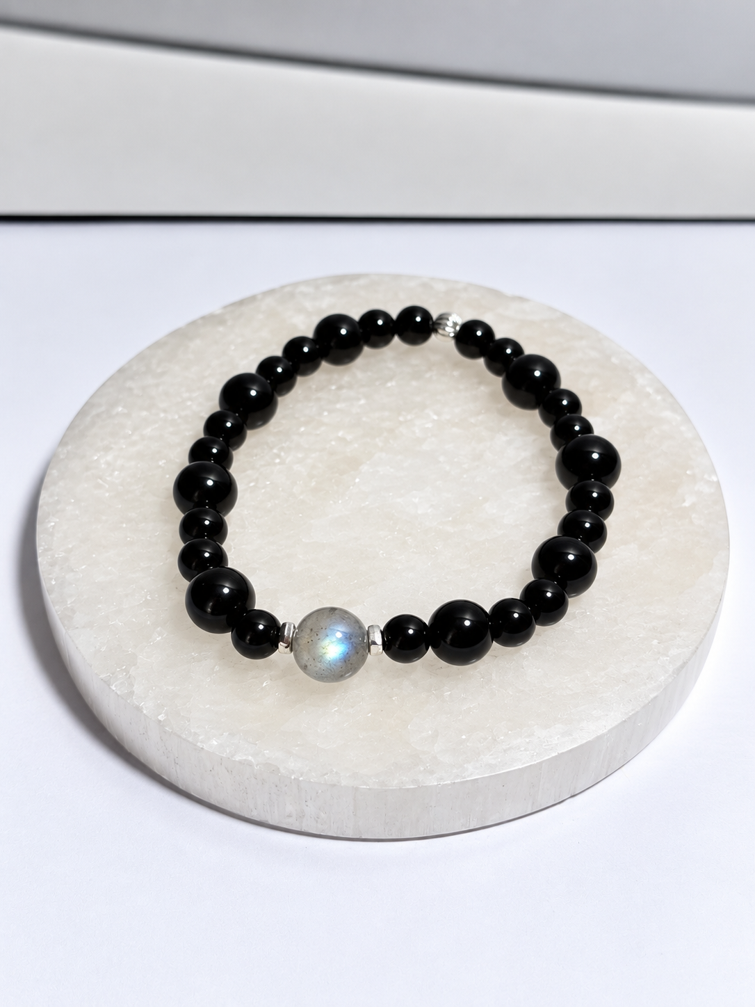 Black Onyx 6-8mm stretch bracelet with 8mm Labradorite center bead and silver accents