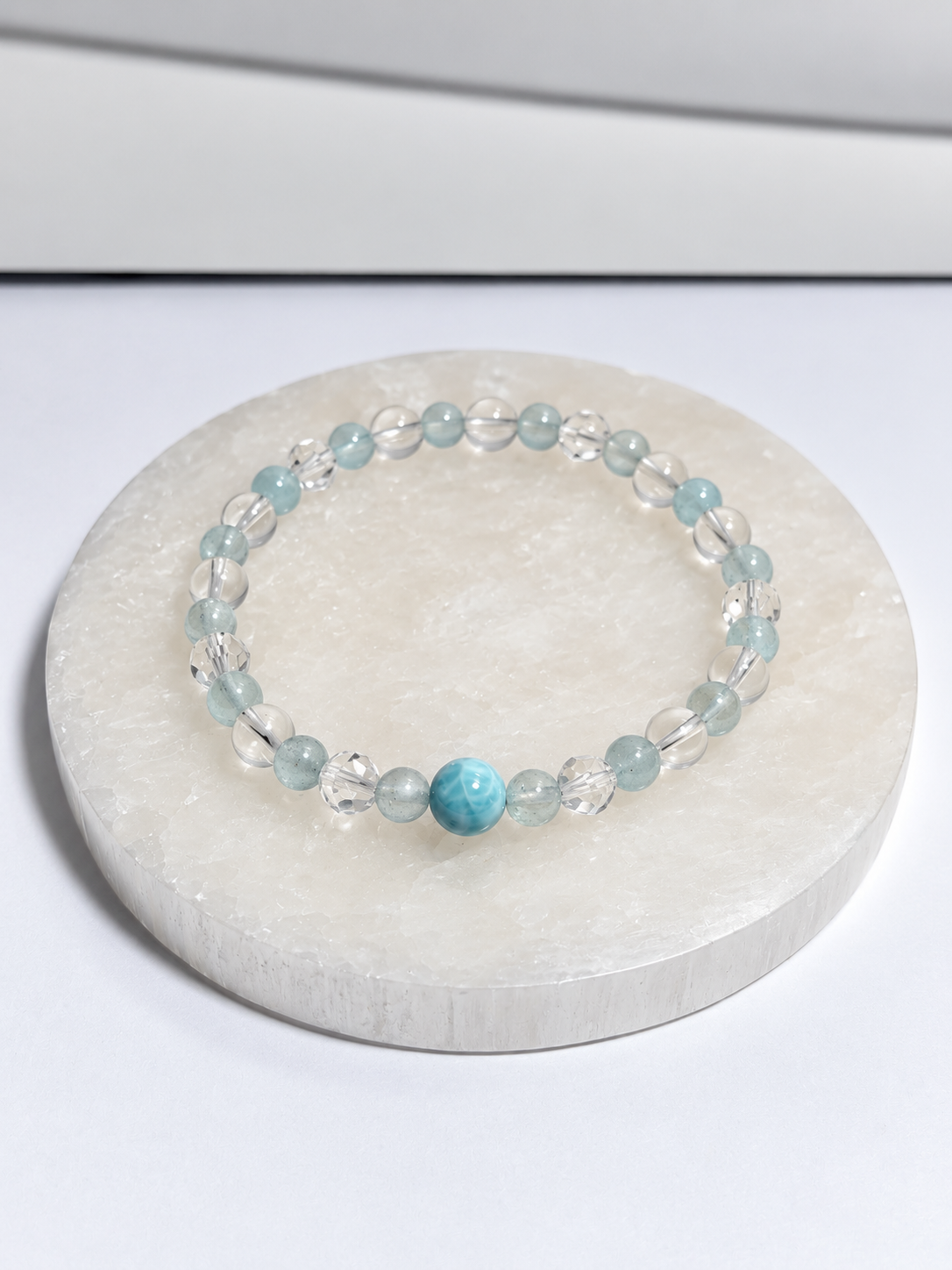 Clear quartz and topaz 5mm stretch bracelet with 6mm Larimar center bead