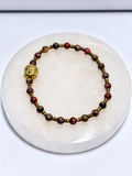 4 millimeter crazy lace agate stretch bracelet with brass Buddha focal and antique brass spacers