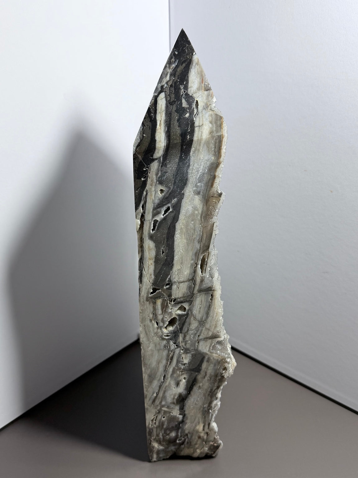 13-inch 7-pound druzy chalcedony tower side view showing polished banding and natural druzy edge
