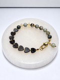 Clasp bracelet with two Ethiopian opal discs, silver sheen obsidian heart beads, jasper beads, and brass findings