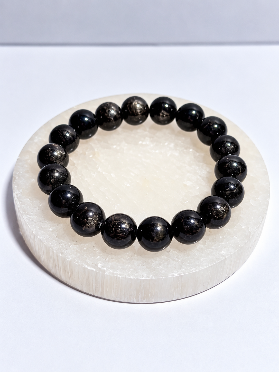 Hypersthene stretch bracelet with polished round beads and natural internal flash