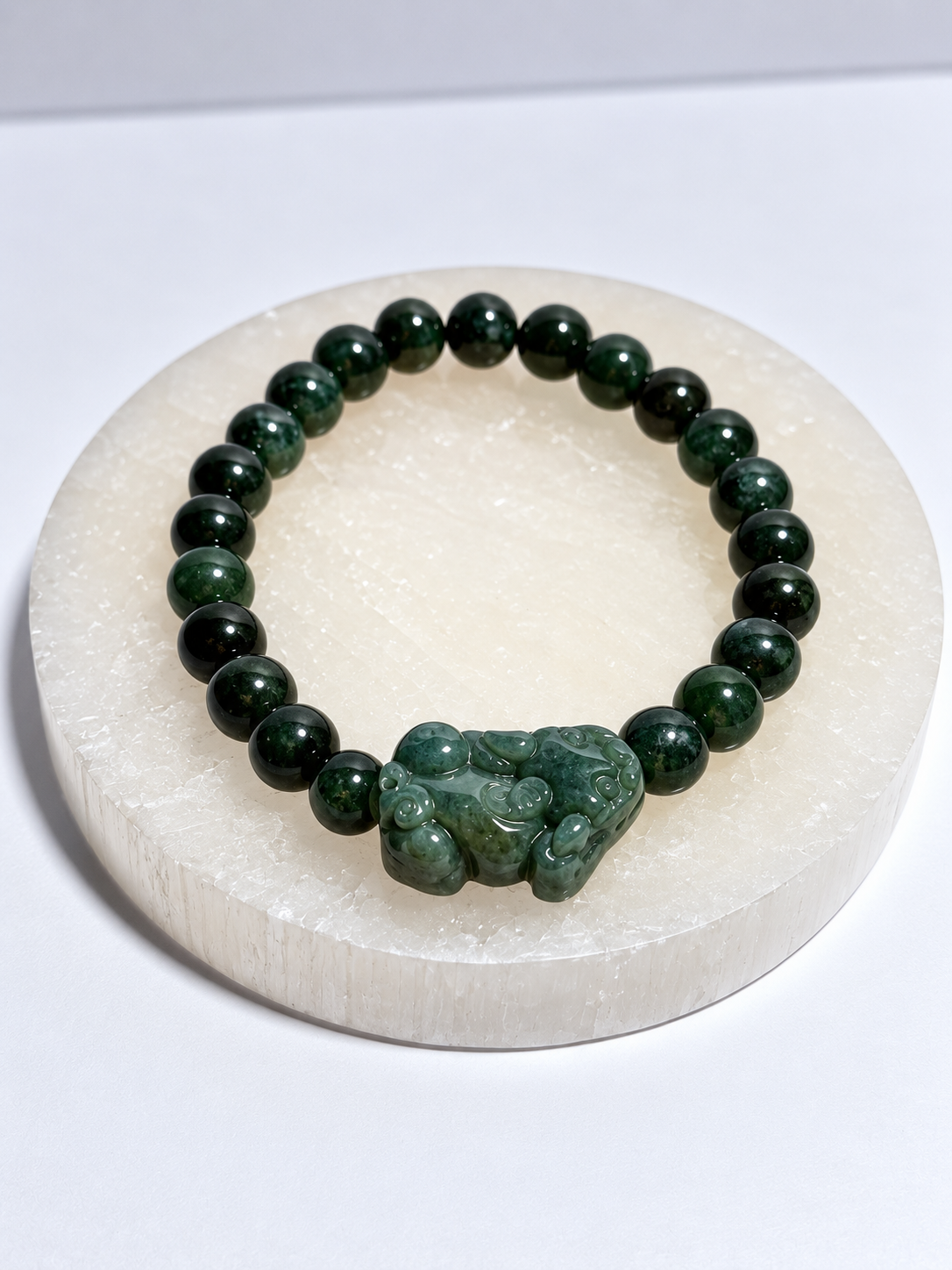 Dark green nephrite jade 7 mm stretch bracelet with carved Pixiu focal