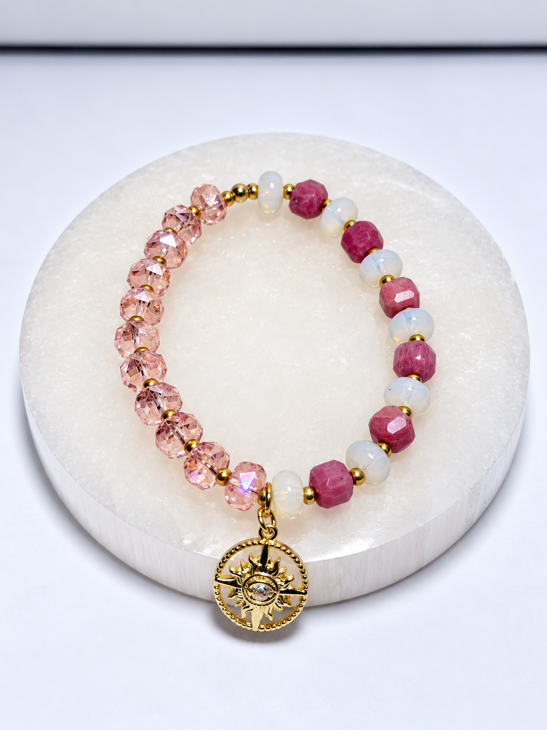 Rhodonite and opalite stretch bracelet with glass beads, brass spacers and mother of pearl charm