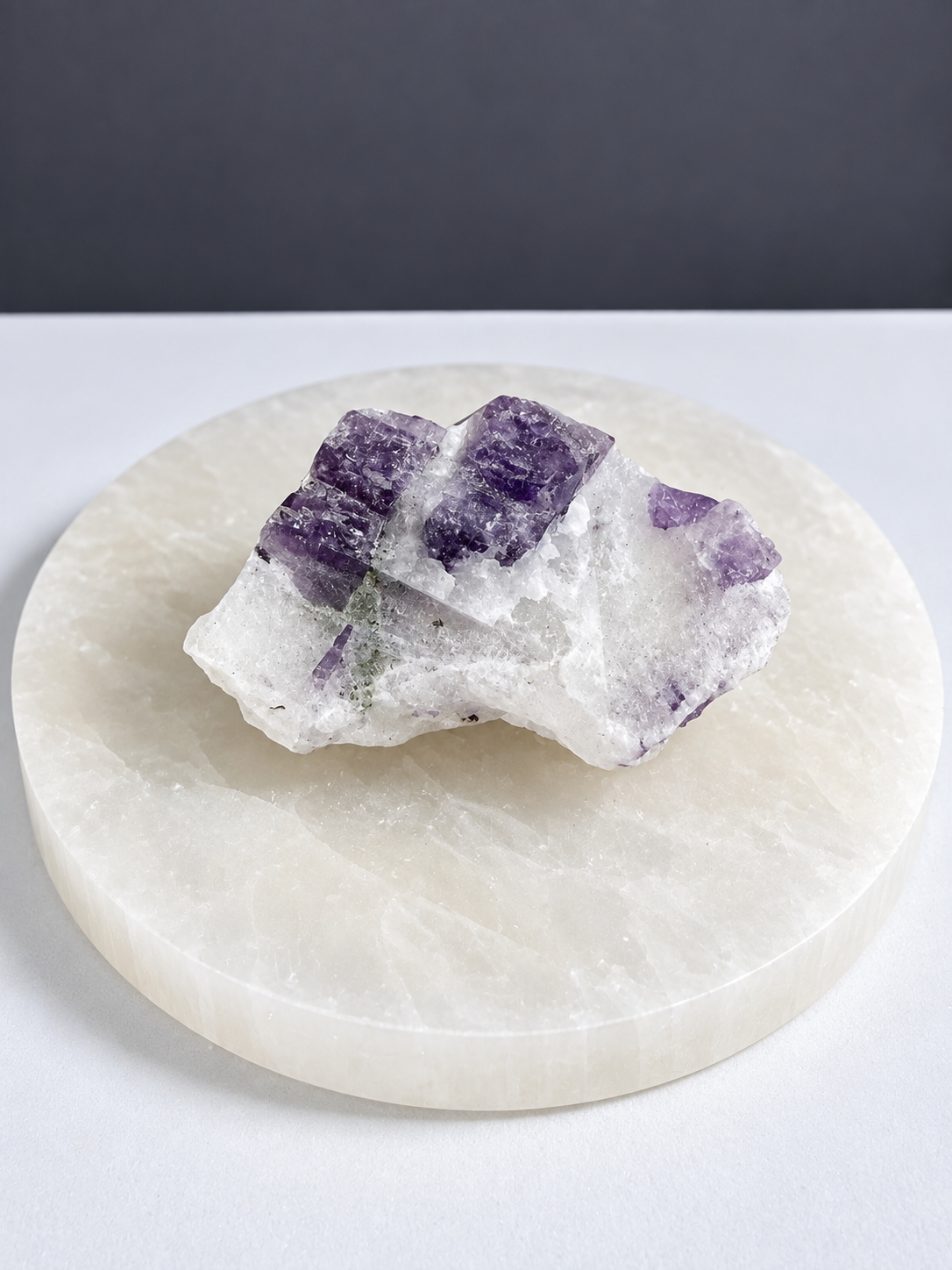 Purple scapolite mineral specimen on matrix