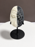 Tai Chi Stone black and white Buddha and guardian relief carving displayed on black stand