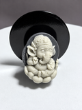 Tai Chi Stone Ganesha relief carving with elephant head, crown, jewelry and seated lotus form