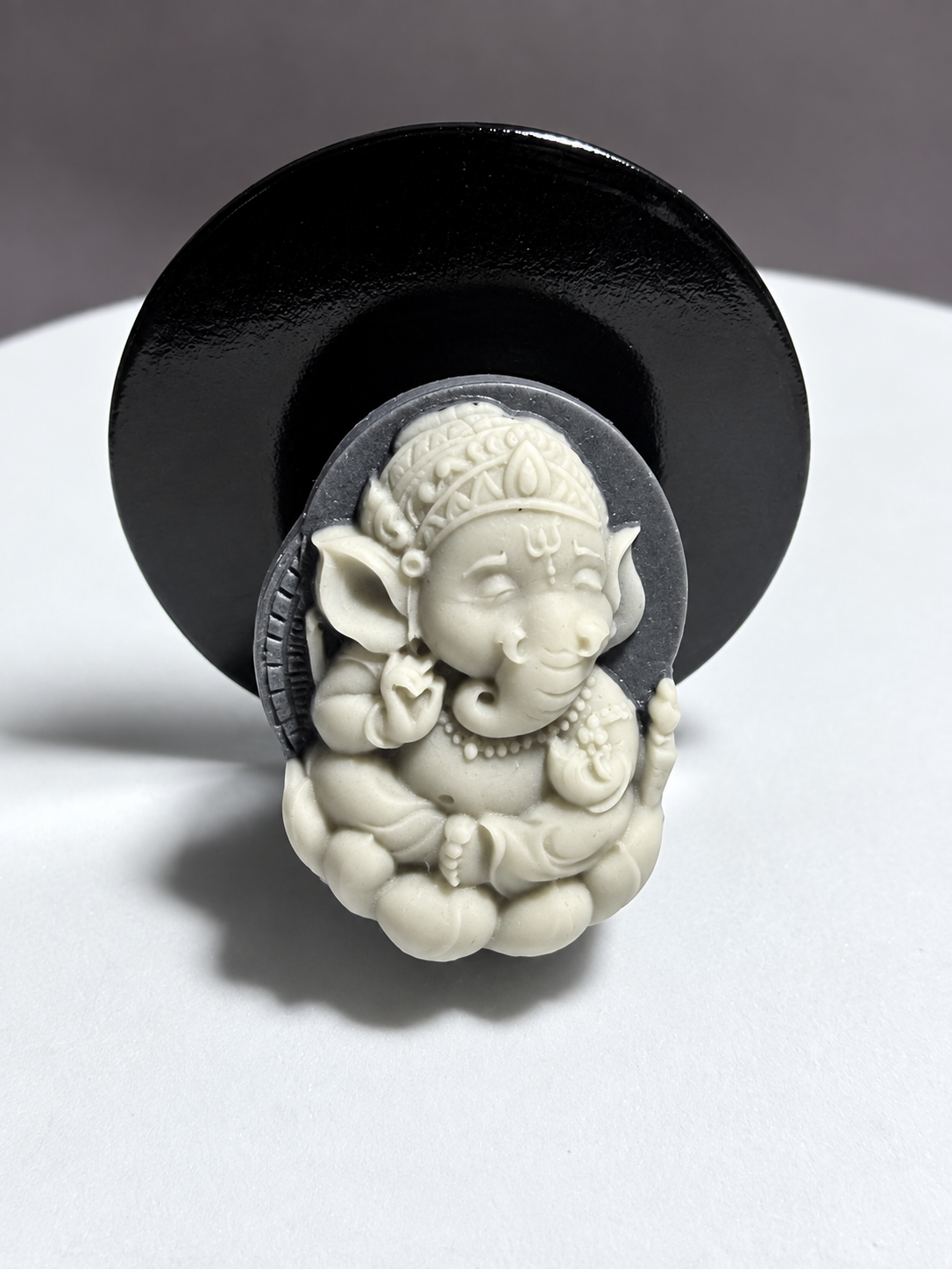Tai Chi Stone Ganesha relief carving with elephant head, crown, jewelry and seated lotus form