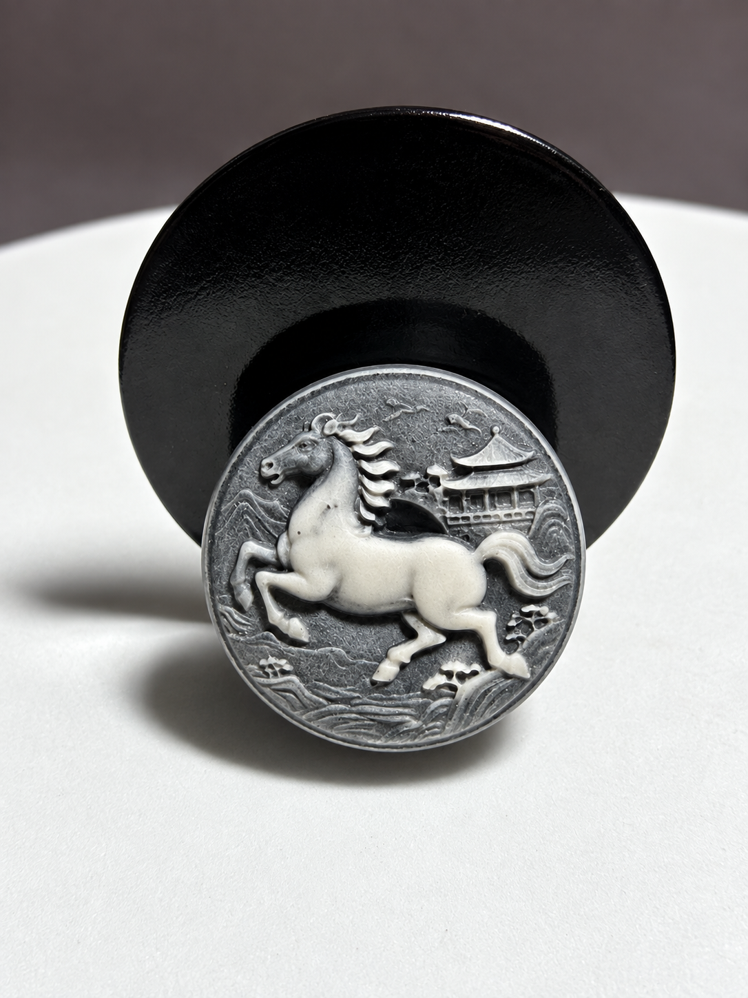 Tai Chi Stone circular horse medallion carving with pagoda, mountain, cloud and wave motifs