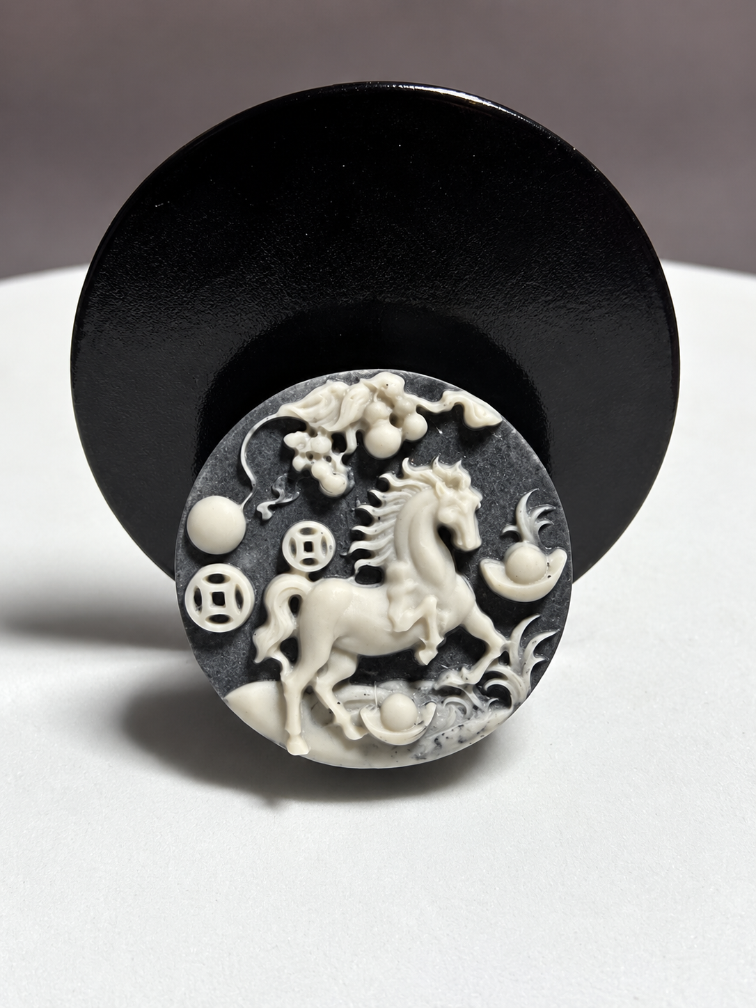 Tai Chi Stone circular horse medallion carving with coin, ingot, cloud and prosperity motifs
